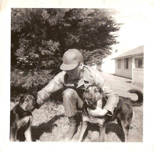 Behind B-2-51 mess hall. That's me with our two sentry dogs.
